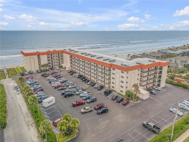 bird's eye view featuring a beach view and a water view