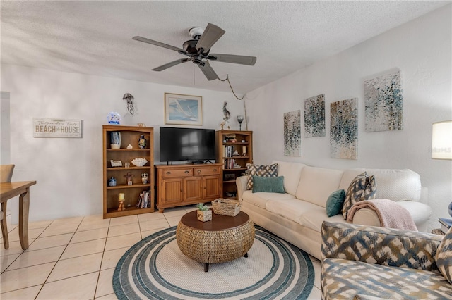 tiled living room with ceiling fan and a textured ceiling