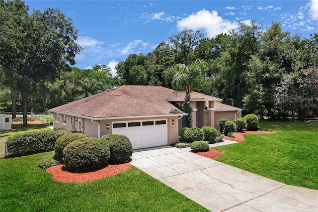 mediterranean / spanish-style home with a garage and a front yard