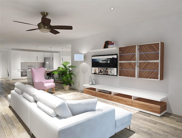 living room with light wood-type flooring and ceiling fan