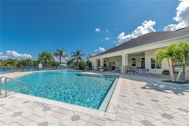 view of swimming pool featuring a patio area and pool water feature