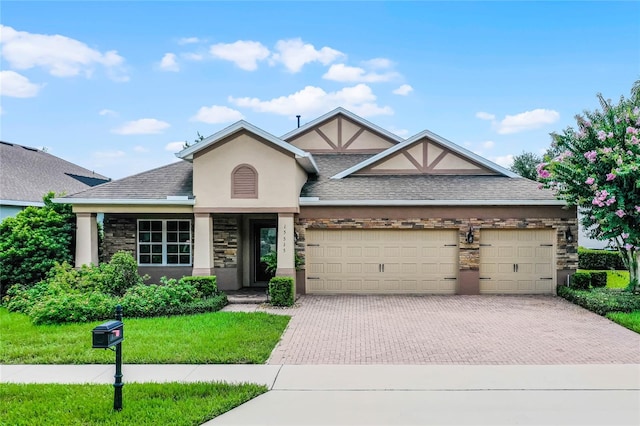 view of front facade featuring a garage and a front lawn