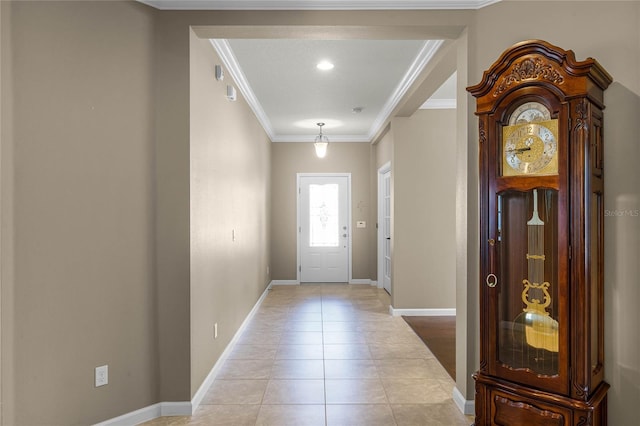 entryway with light hardwood / wood-style floors and ornamental molding