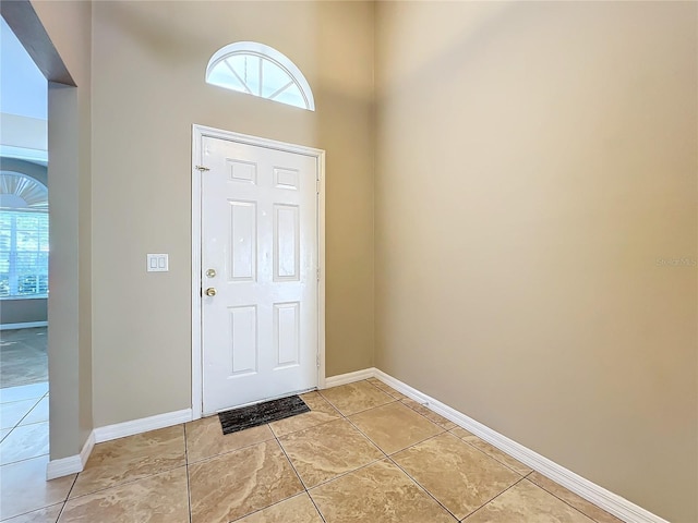 foyer featuring light tile patterned floors