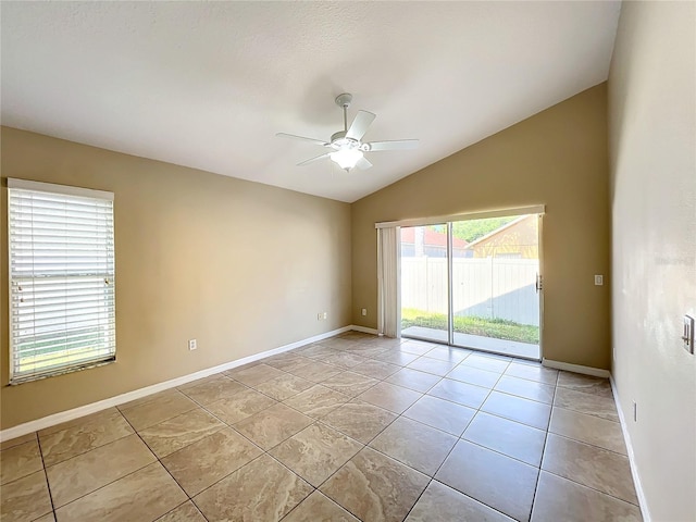 unfurnished room featuring lofted ceiling, ceiling fan, and light tile patterned floors