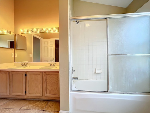 bathroom with lofted ceiling, bath / shower combo with glass door, tile patterned flooring, and vanity