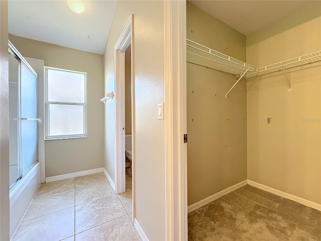 walk in closet featuring light tile patterned floors