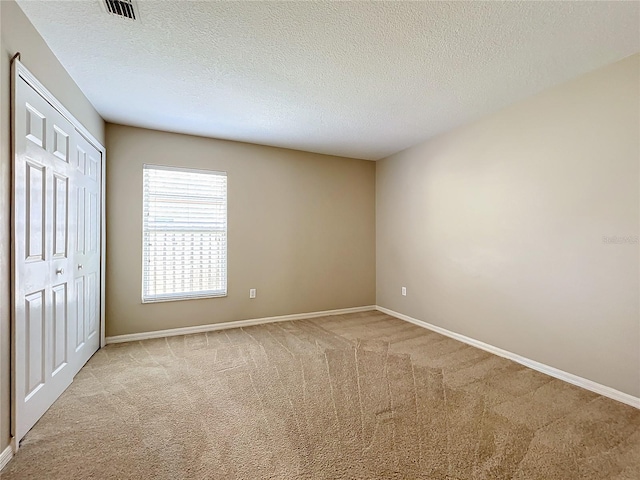 interior space with a textured ceiling