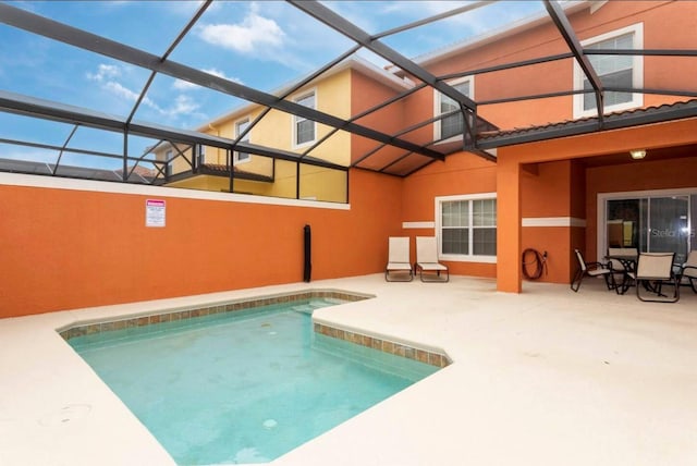 view of pool featuring a lanai and a patio area