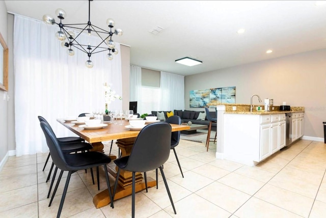 tiled dining area with a chandelier