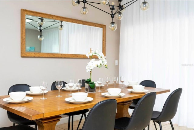 dining space featuring an inviting chandelier