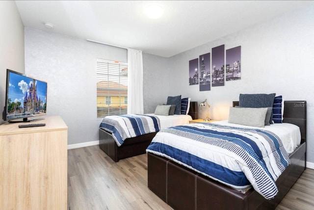 bedroom with light wood-type flooring