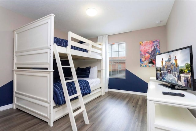 bedroom featuring dark wood-type flooring