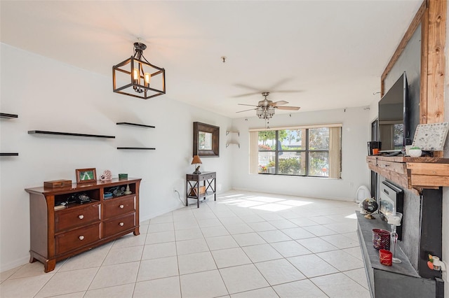 living room featuring ceiling fan and light tile patterned floors