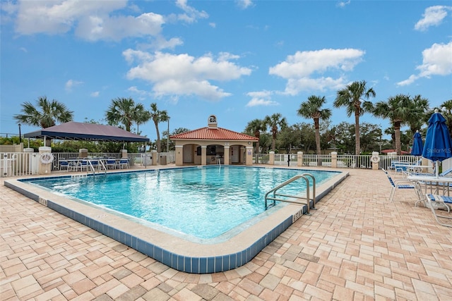 view of swimming pool featuring a gazebo and a patio