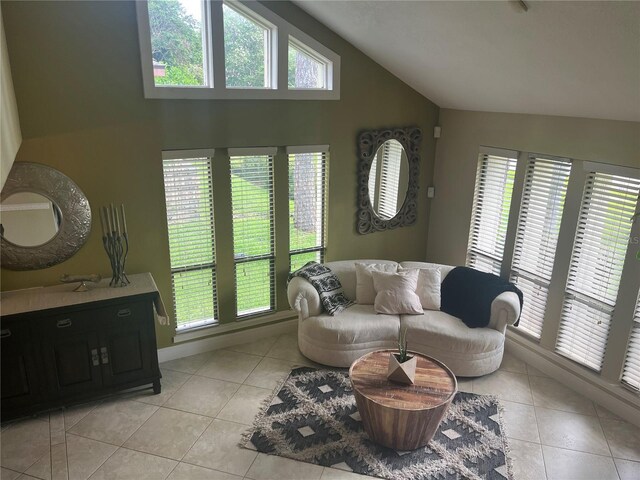 tiled living room featuring vaulted ceiling