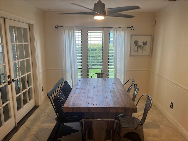 dining space featuring french doors, ceiling fan, and light tile patterned floors