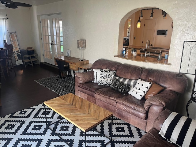 living room featuring dark wood-type flooring