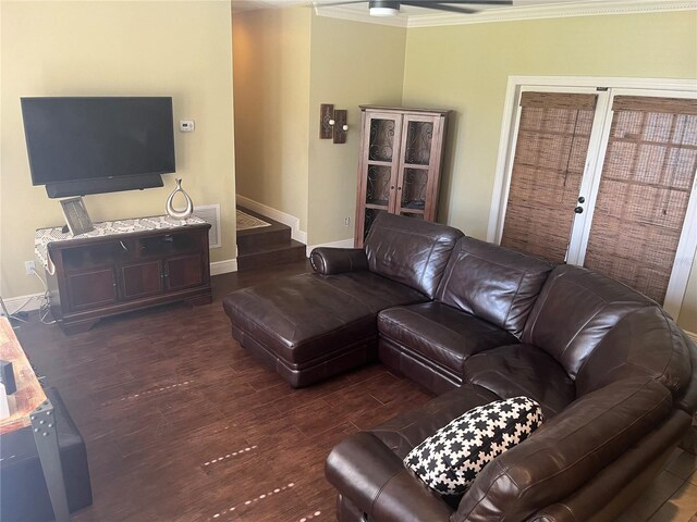 living room featuring dark hardwood / wood-style floors, ceiling fan, and crown molding