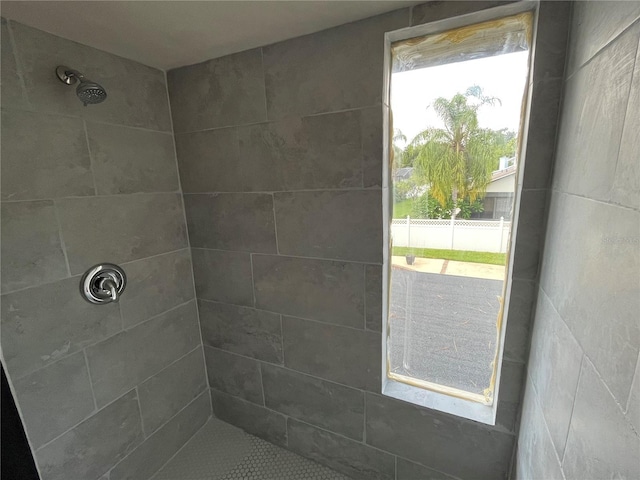 bathroom featuring tiled shower