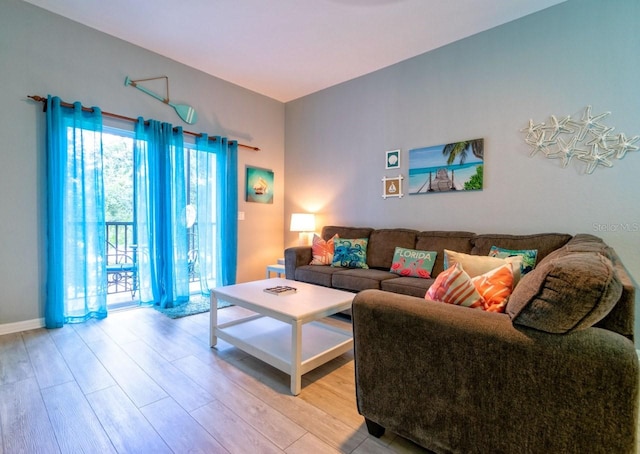 living room with light hardwood / wood-style flooring