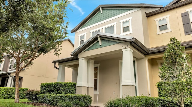 view of side of property featuring stucco siding