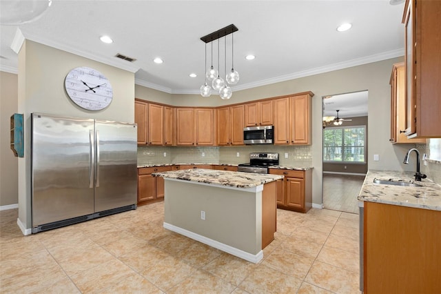 kitchen featuring light stone countertops, a center island, stainless steel appliances, sink, and hanging light fixtures