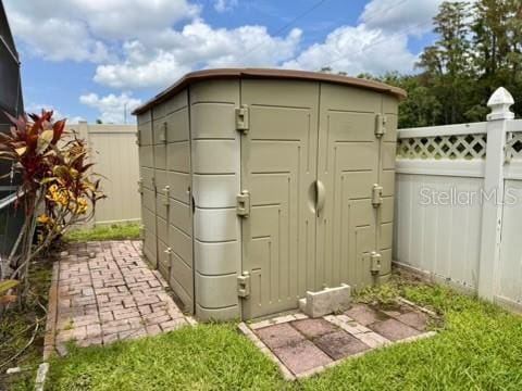 5135 Warrior Ln, Kissimmee, FL 34746 - view of shed with a fenced backyard