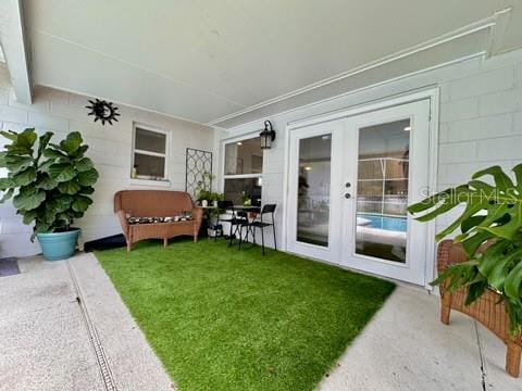 view of yard with a patio and french doors