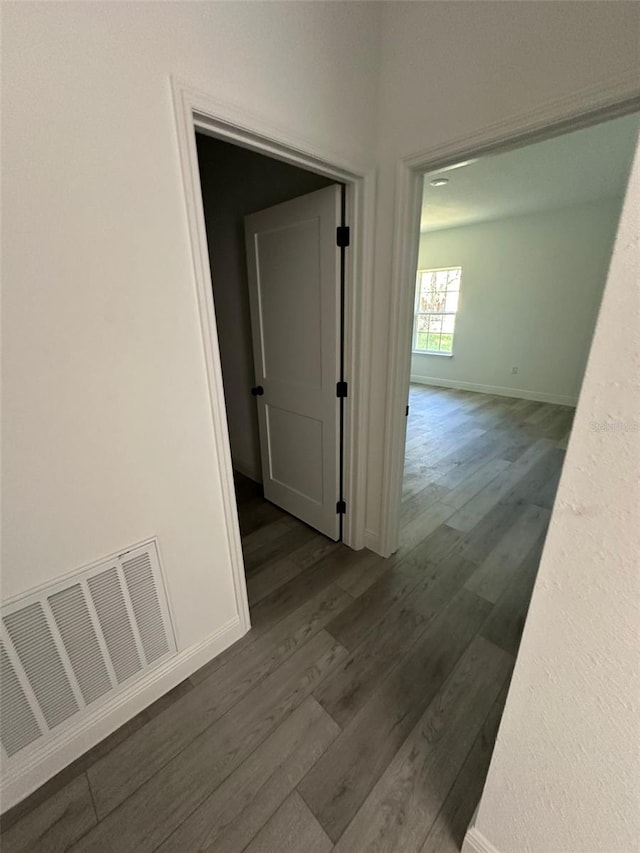 hallway featuring dark wood-type flooring