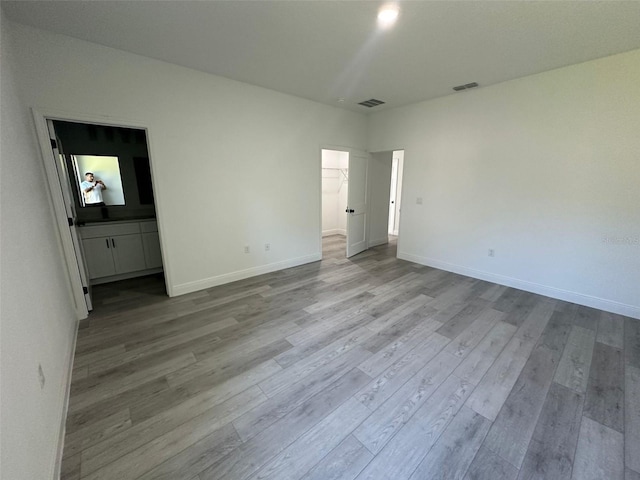 empty room with light wood-type flooring