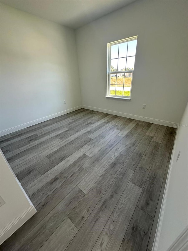 empty room with hardwood / wood-style floors