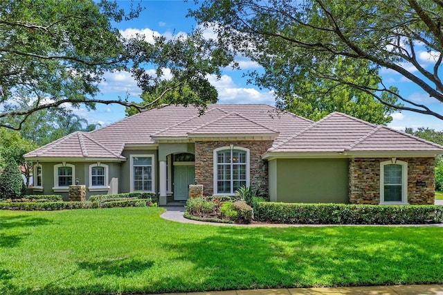 ranch-style home with a front lawn