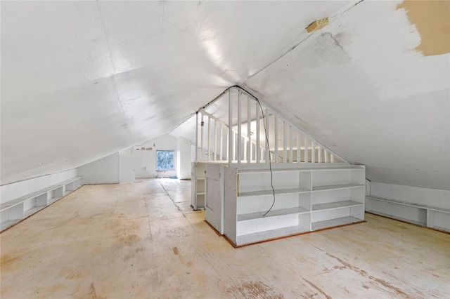 additional living space with vaulted ceiling