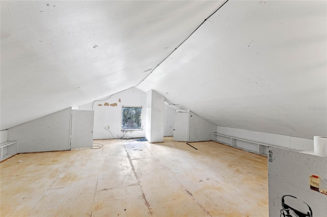 additional living space featuring vaulted ceiling