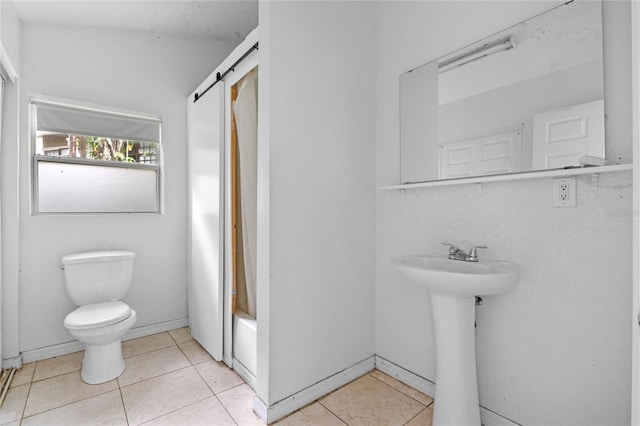 full bathroom with sink, toilet, tile patterned flooring, and shower / bathtub combination