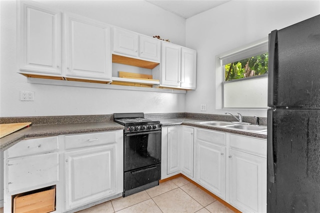 kitchen with white cabinetry, light tile patterned flooring, sink, and black appliances