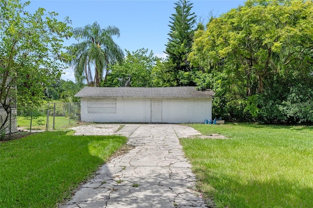 garage featuring a lawn