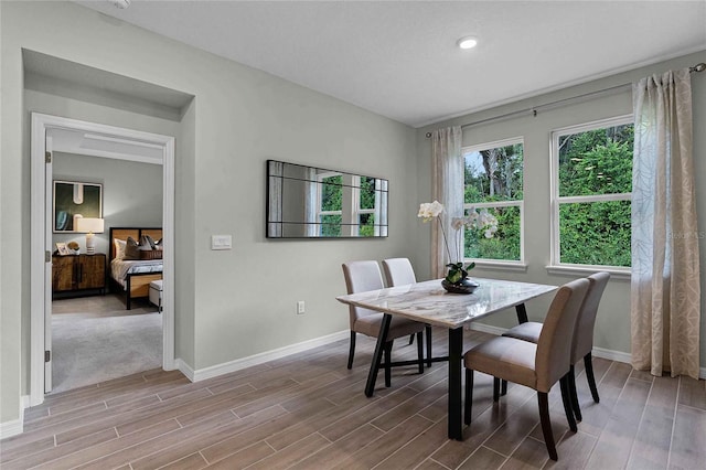 dining area with wood finish floors, recessed lighting, and baseboards