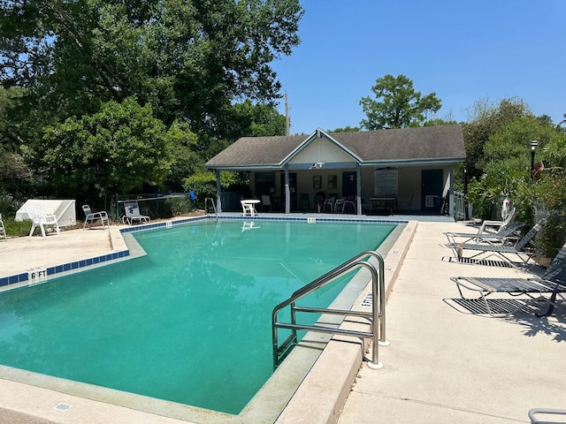 view of swimming pool with a patio area