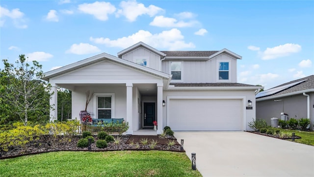 view of front of property with a garage and a front yard