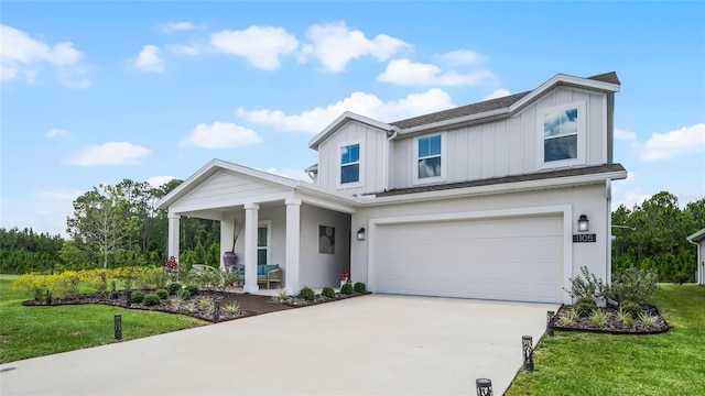 view of front of house with a garage and a front yard