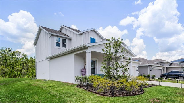 view of front of house with a garage and a front yard