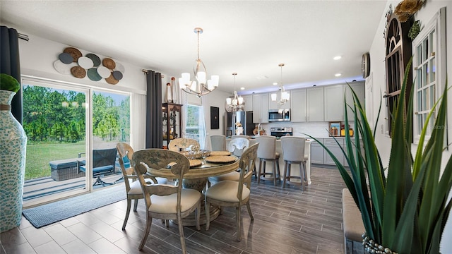 dining area featuring a notable chandelier