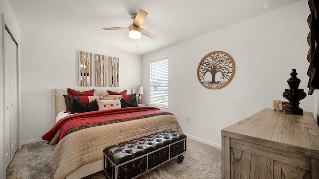 bedroom featuring ceiling fan, a closet, and carpet flooring