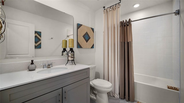 full bathroom featuring vanity, toilet, and shower / bath combination with curtain