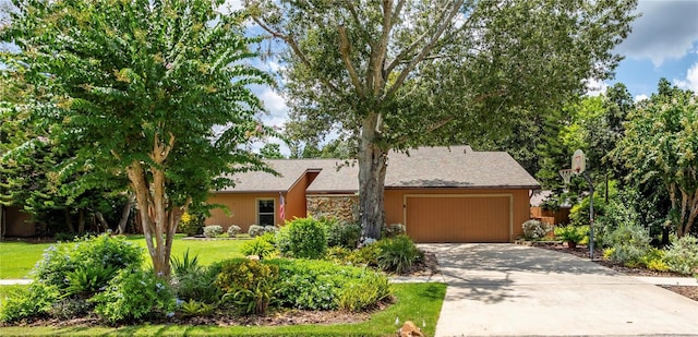 ranch-style home with a front lawn and a garage