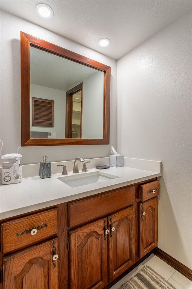 bathroom featuring tile patterned floors and vanity