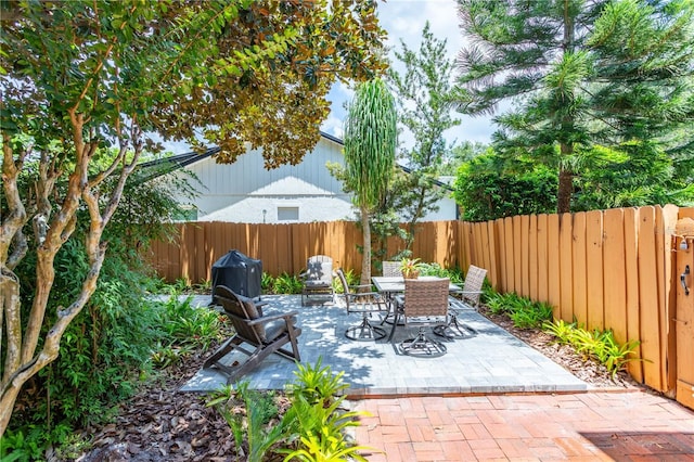 view of patio / terrace featuring outdoor dining area and a fenced backyard