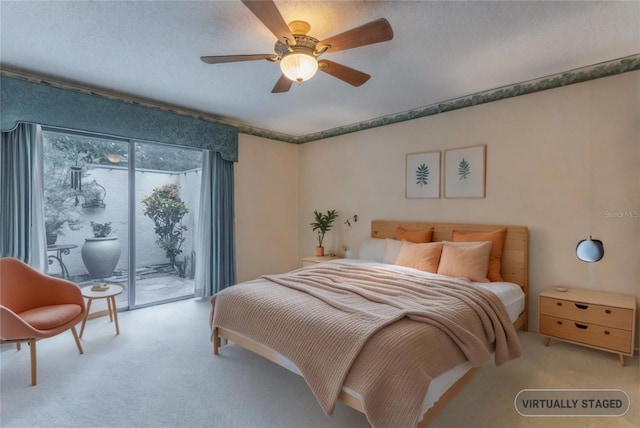 bedroom featuring access to exterior, light carpet, ceiling fan, and a textured ceiling